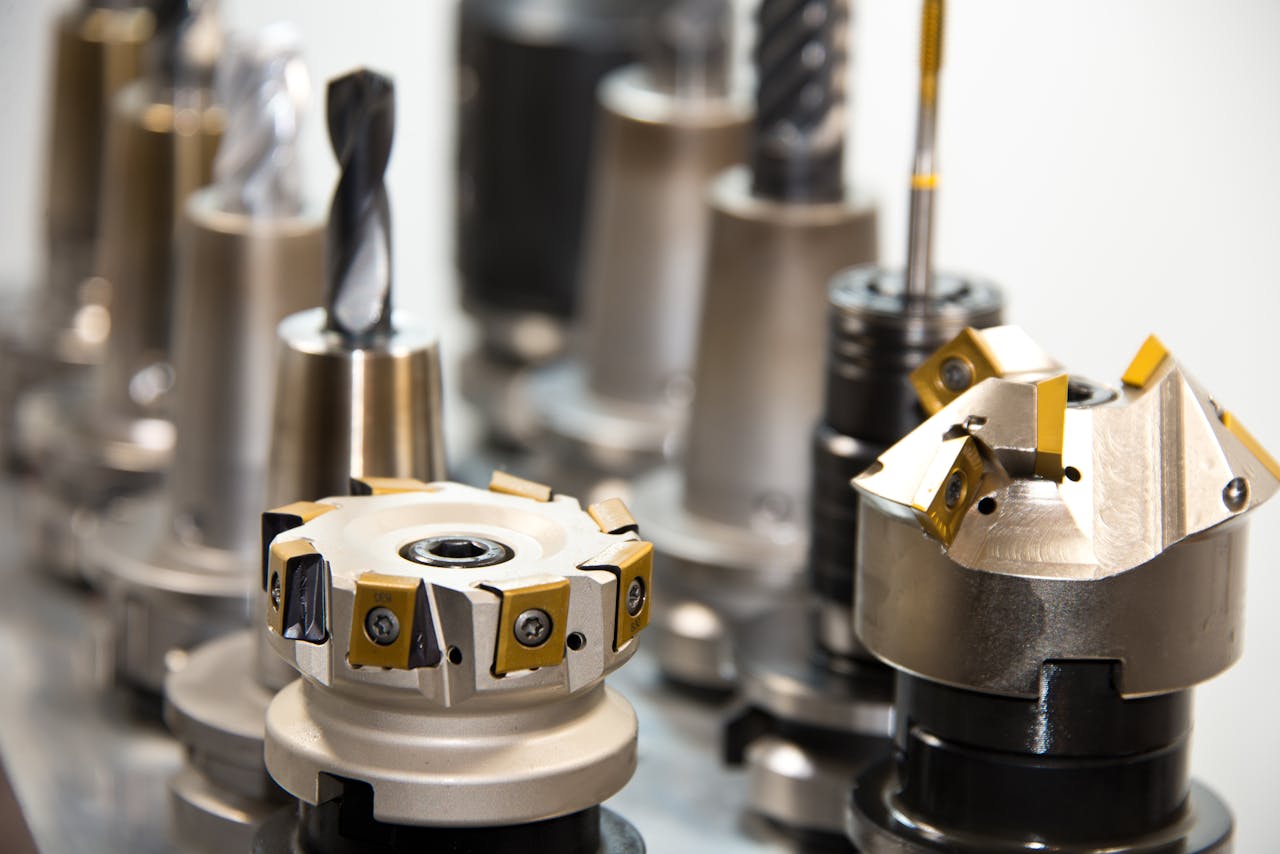 The Art of Drawing Readers In: Your attractive post title goes here Detailed view of various metal drill bits and tools arranged in a workshop setting.